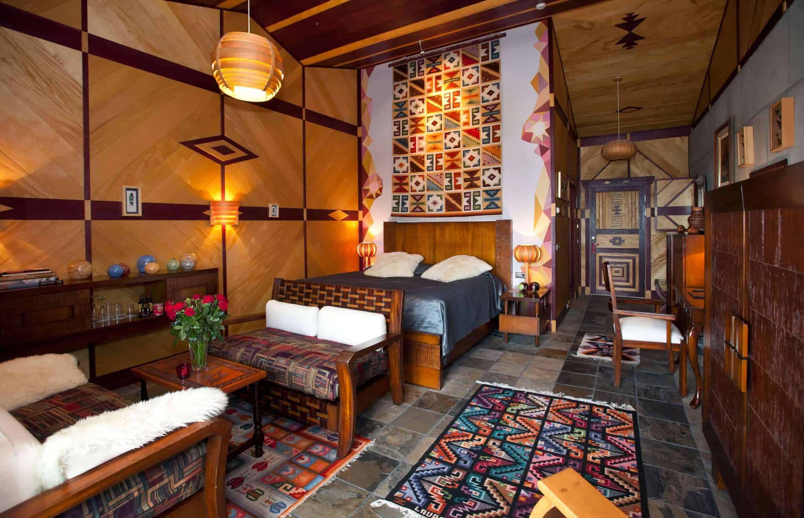 Hotel Rangá's South America suite decorated with colorful tapestries, wooden accents and authentic artwork.