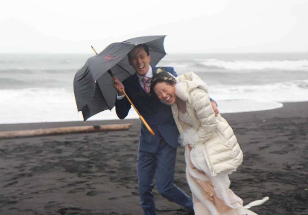 A wedding photoshoot at a Black Sand Beach in Iceland