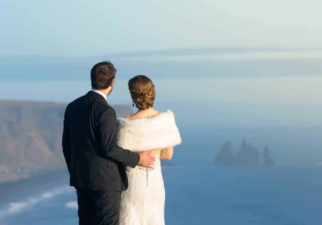 A wedding couple enjoying the view at Reynisfjara black sand beach