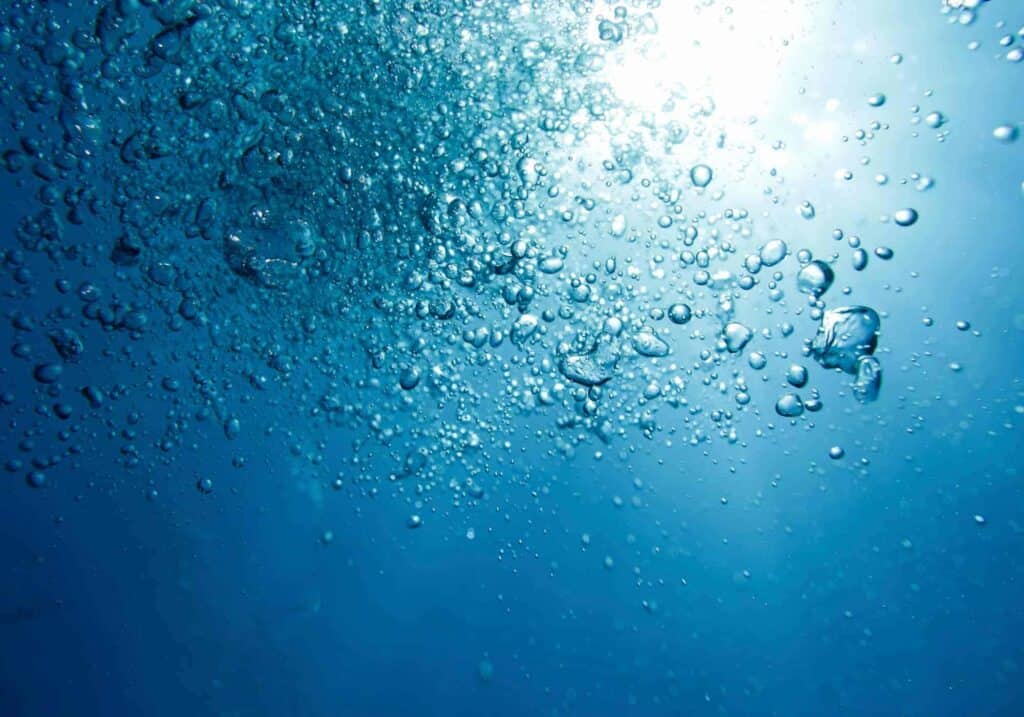 A picture of blue water and bubbles