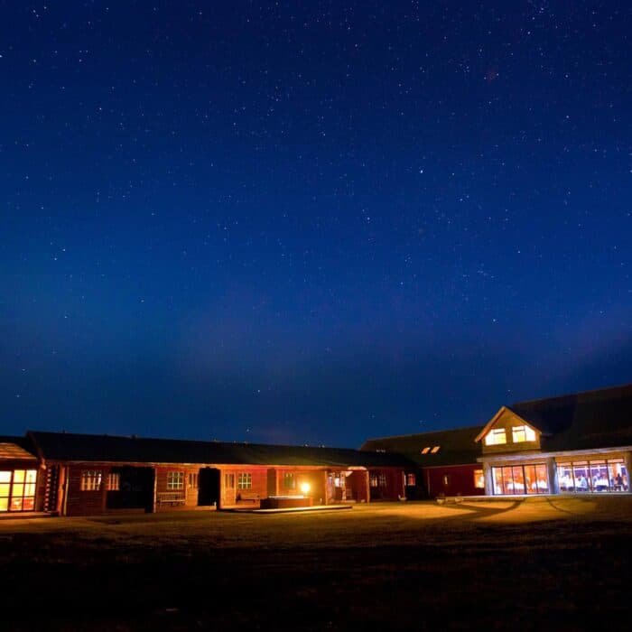 Hotel Rangá luxury hotel underneath a starry night sky in south Iceland.