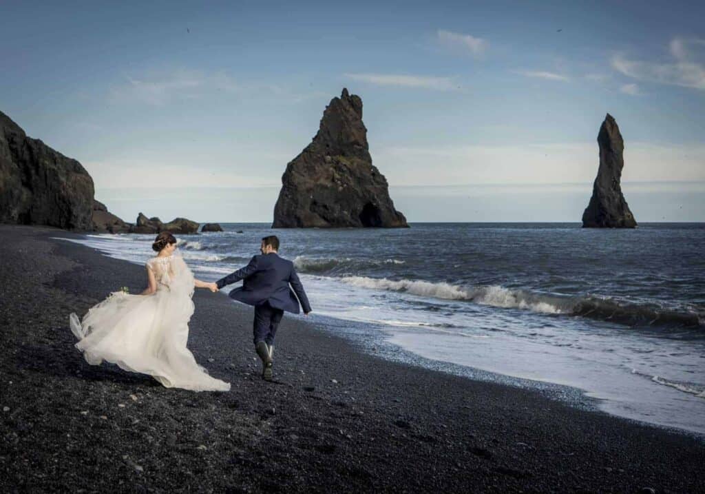 A wedding photo at a black beach in Iceland