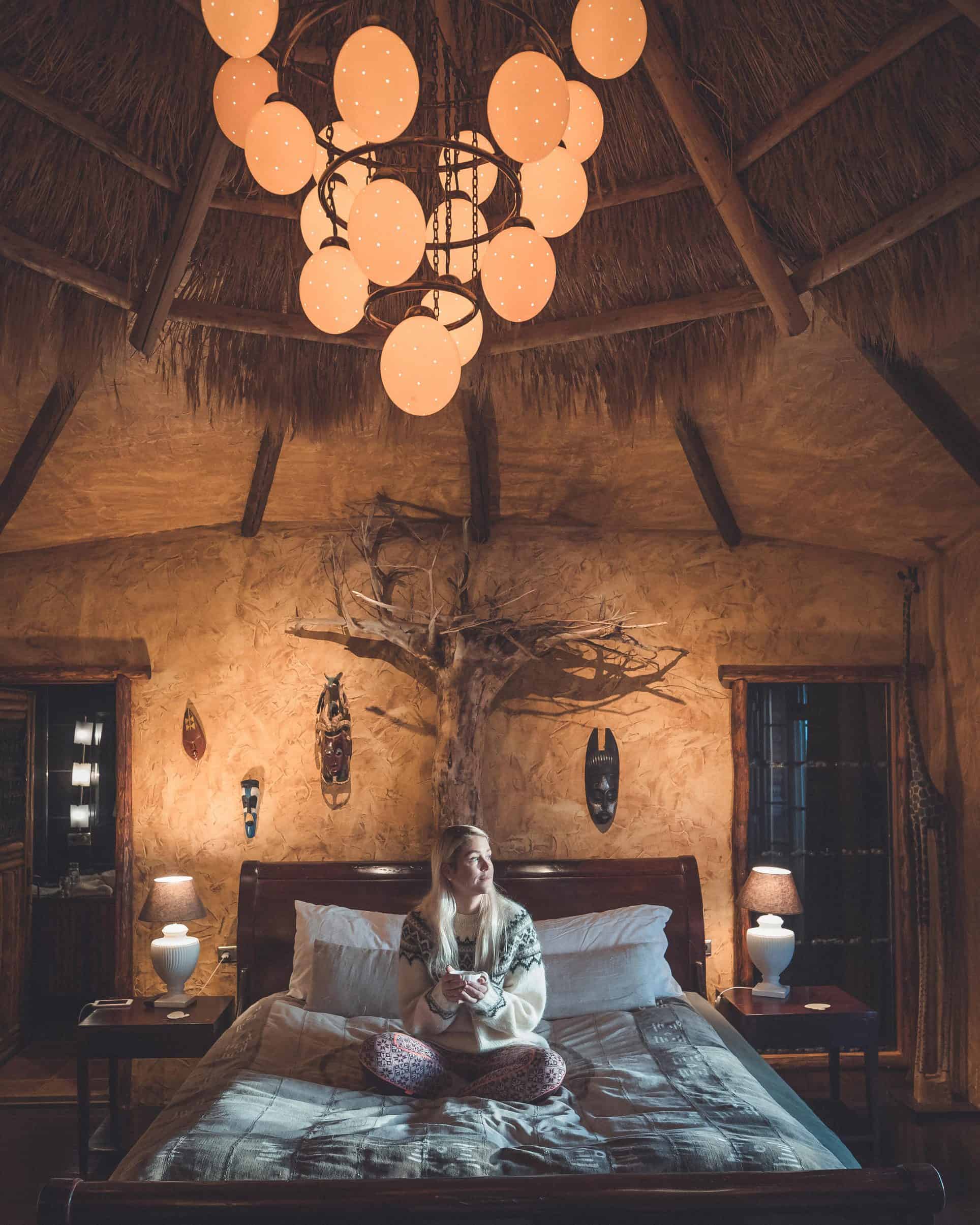 Photographer Ása Steinarsdóttir wearing a traditional Icelandic lopapeysa in our Africa Suite at Hotel Rangá.