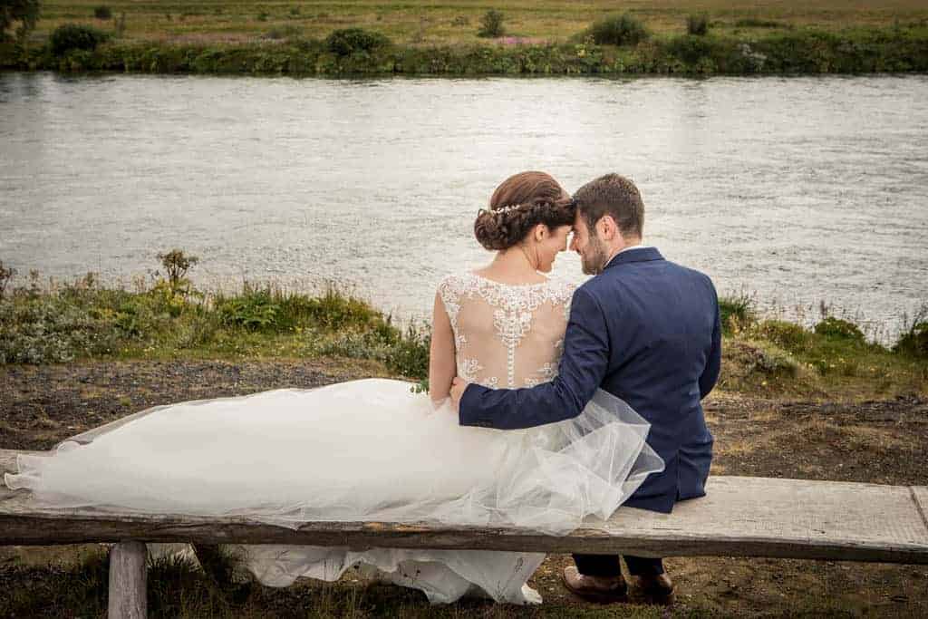 A wedding couple by Rangá River in Iceland