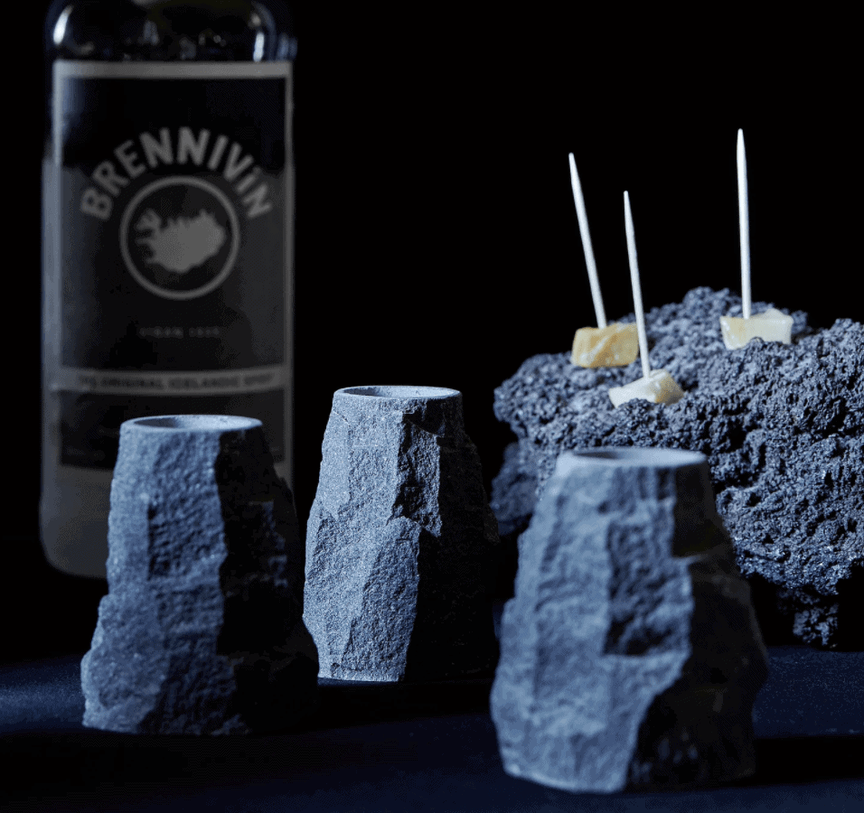 Icelandic lava shot glasses with Brennivín in the background.