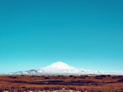 Mount Hekla in south Iceland underneath a blue sky.