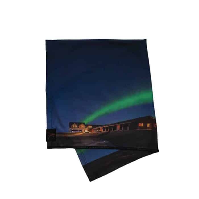 Head buff printed with image of green northern lights above Hotel Rangá.