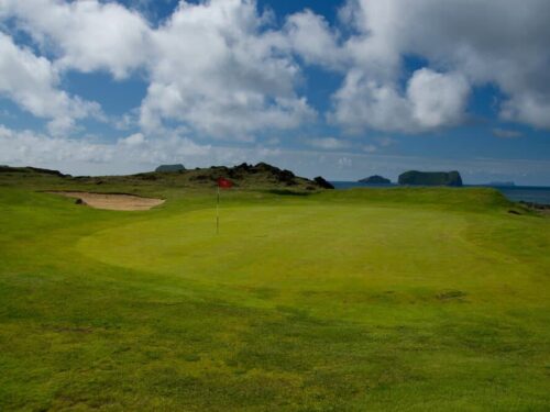 Golf course on Westman Islands on a bright summer's day.