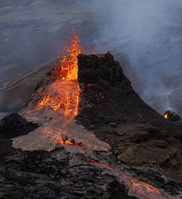 Red hot lava pouring of the the Fagradalsfjall volcano in Iceland.