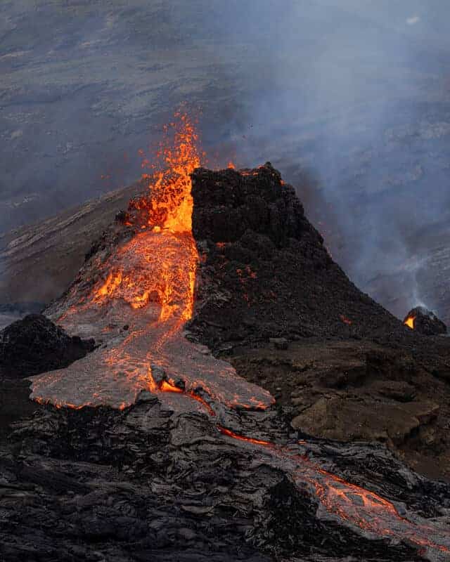 Red hot lava pouring of the the Fagradalsfjall volcano in Iceland.