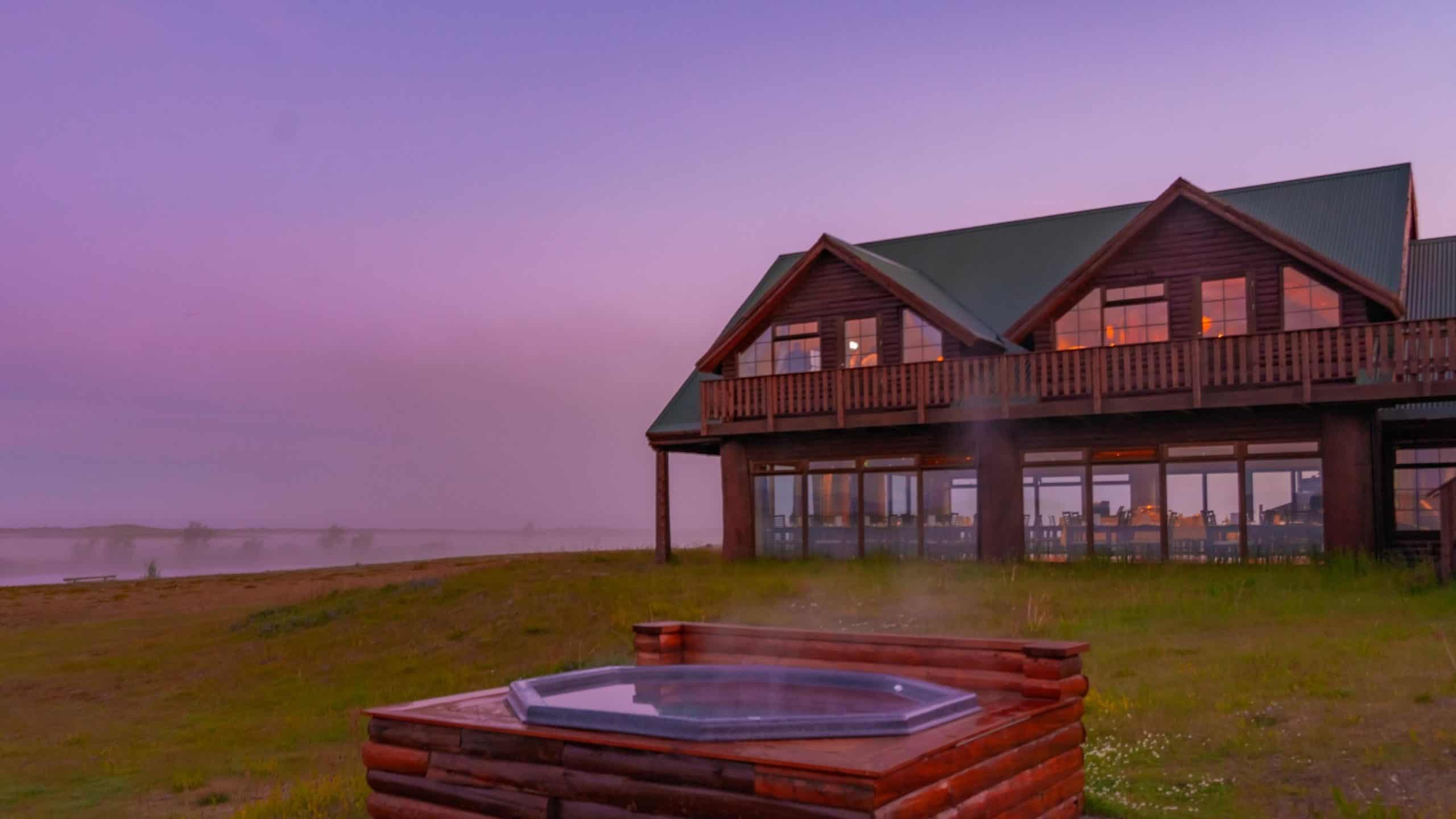 Geothermal hot tubs located outside Hotel Rangá at sunset.