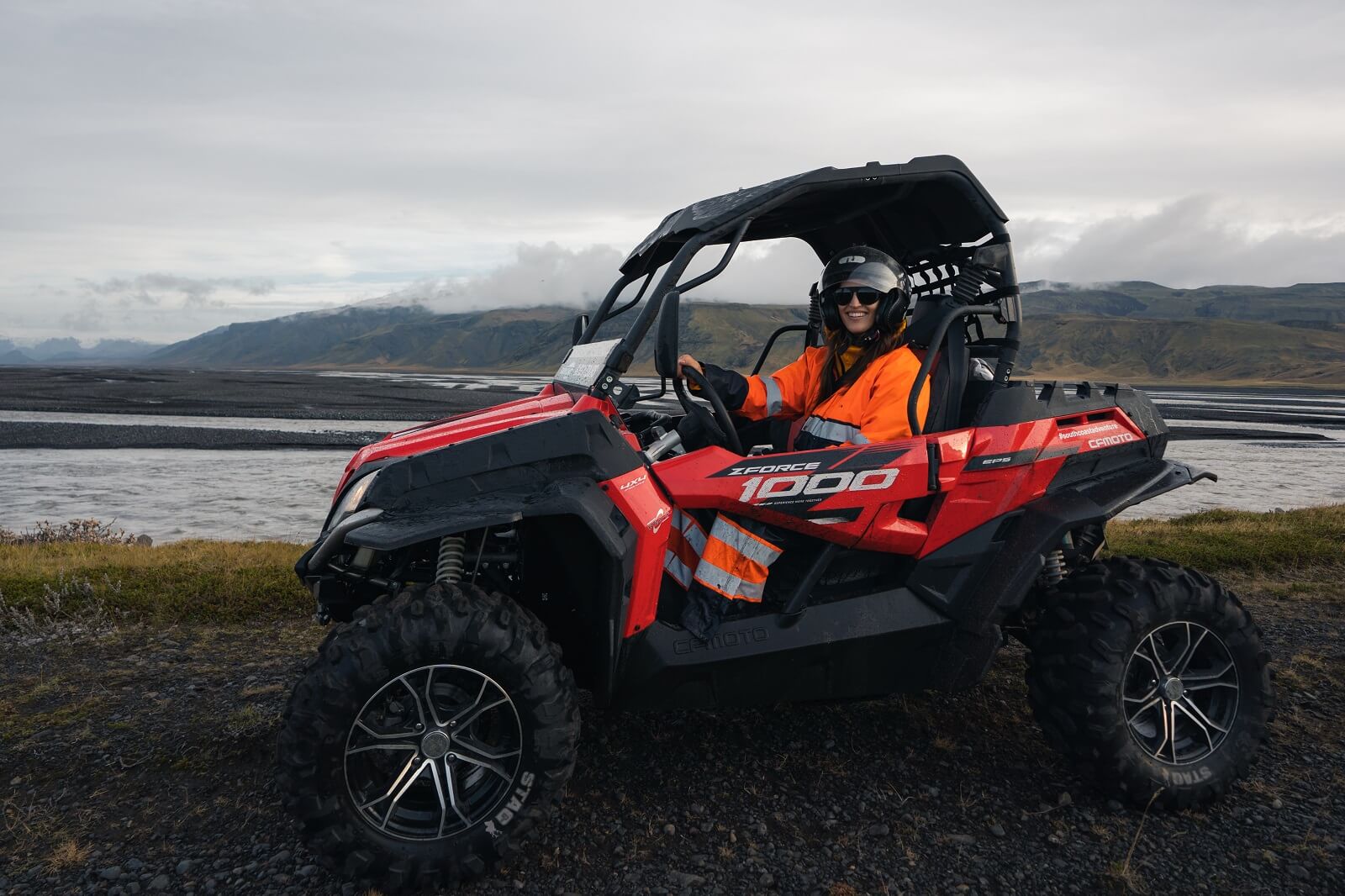 Woman drives a buggy on a tour in south Iceland.