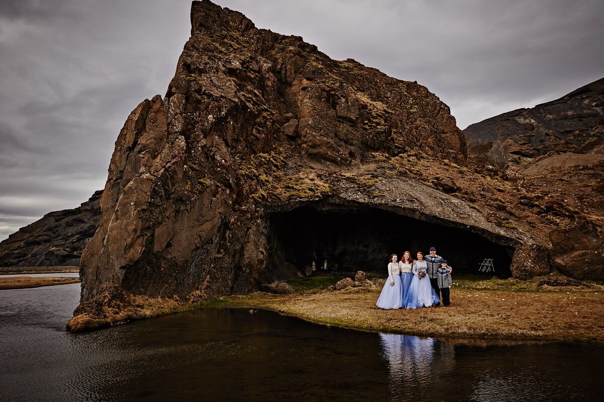 Stacey and Jerry on their wedding day with their three children in front of the small cave known as Gapí in south Iceland.