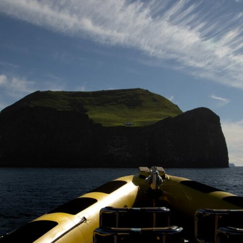 View from a rib safari boat on the ocean looking out at the Westman Islands.