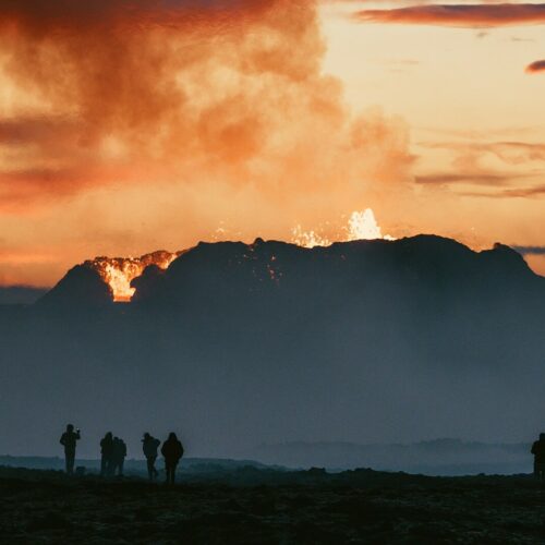 People watch Iceland's newest volcano erupting in July 2023 near Litli Hrútur.