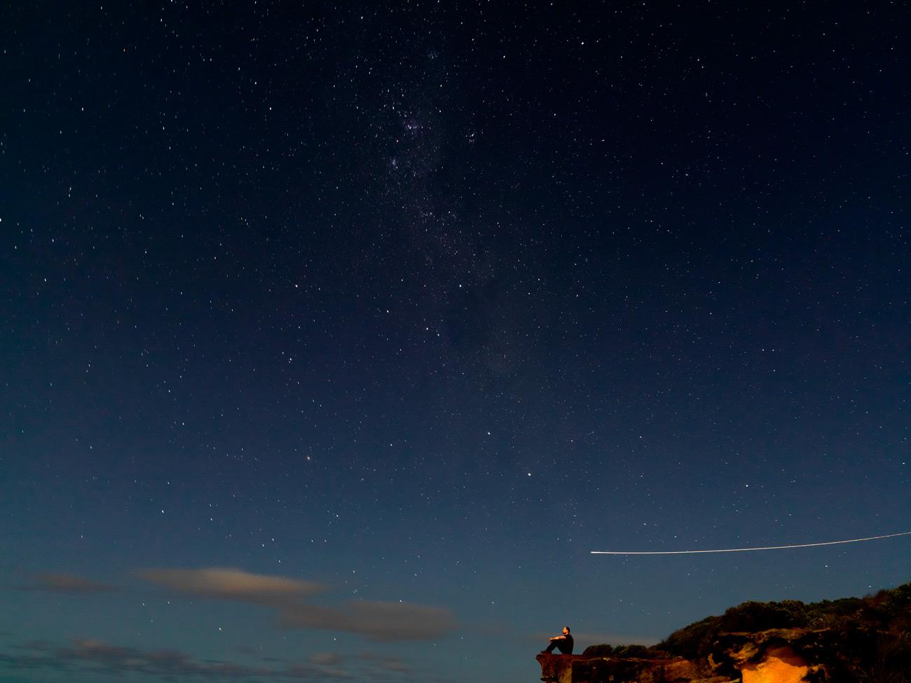 Astronomer Duane Hamacher gazes at the night sky.
