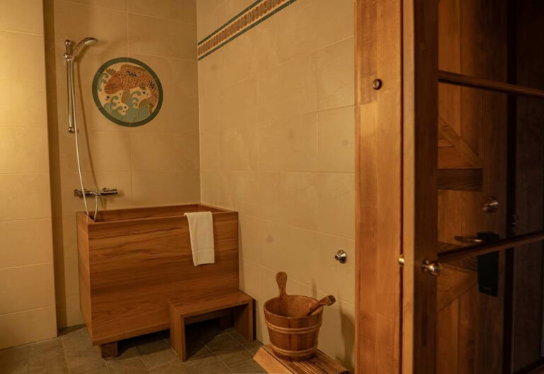 Bathroom in Hotel Rangá Asia suite with a traditional Japanese wooden soaking tub and bucket.