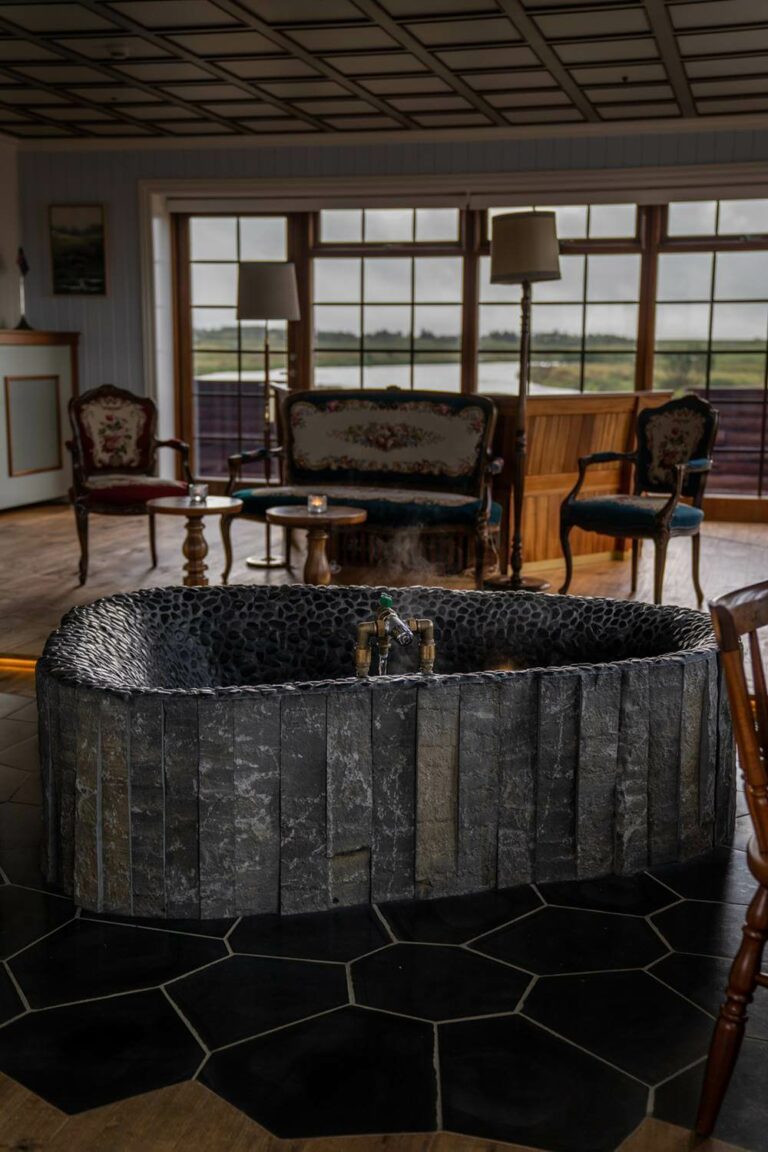 The Hotel Rangá Icelandic Suite is decorated with traditional wooden furniture and a basalt soaking tub.