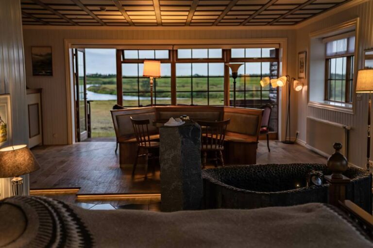 The Hotel Rangá Icelandic Suite is decorated with traditional wooden furniture, a basalt soaking tub and a King bed covered with a lopapeysa blanket.