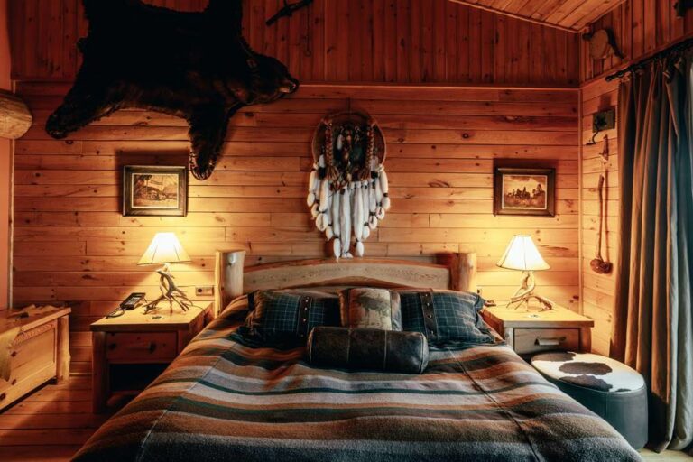 Hotel Rangá's North America Suite decorated with a bearskin, Native American artwork and rustic touches.
